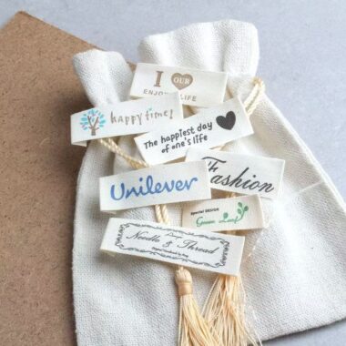 Beige embroidered alphabet clothing label for garments and bags