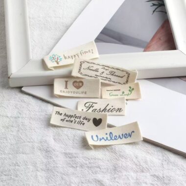 Beige embroidered alphabet clothing label for garments and bags