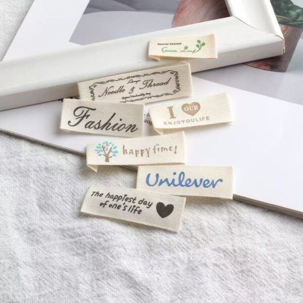 Beige embroidered alphabet clothing label for garments and bags