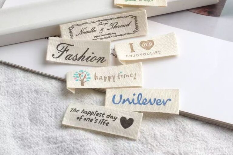 Beige embroidered alphabet clothing label for garments and bags