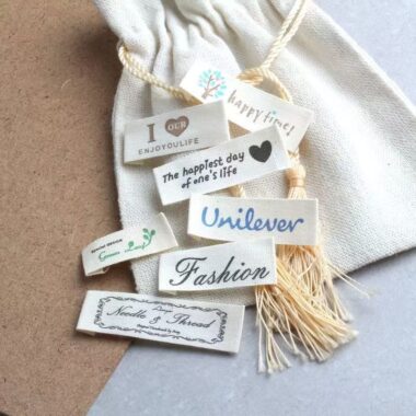 Beige embroidered alphabet clothing label for garments and bags