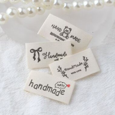 Beige embroidered alphabet woven label for clothing and handmade accessories