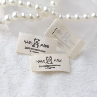 Beige embroidered alphabet woven label for clothing and handmade accessories