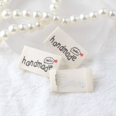 Beige embroidered alphabet woven label for clothing and handmade accessories