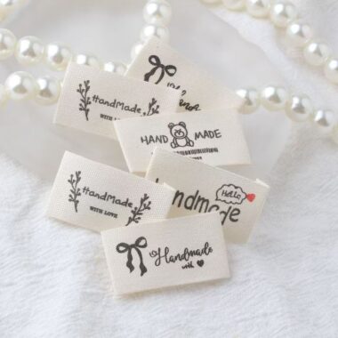 Beige embroidered alphabet woven label for clothing and handmade accessories
