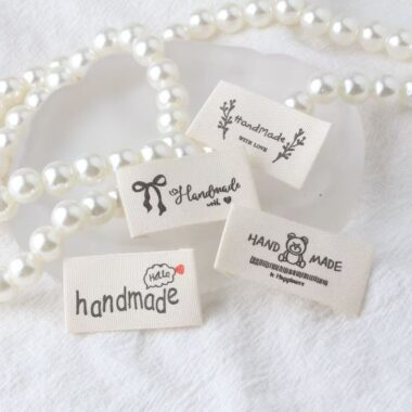 Beige embroidered alphabet woven label for clothing and handmade accessories