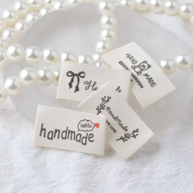 Beige embroidered alphabet woven label for clothing and handmade accessories