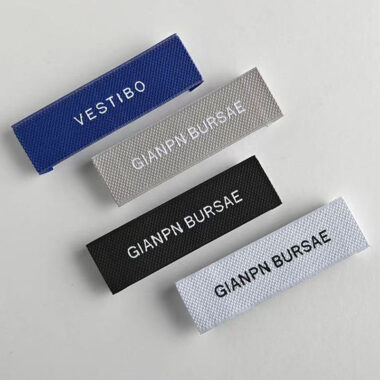 Folded woven neck clothing labels for garments