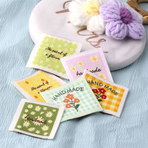 Floral embroidered square clothing labels for fashion garments