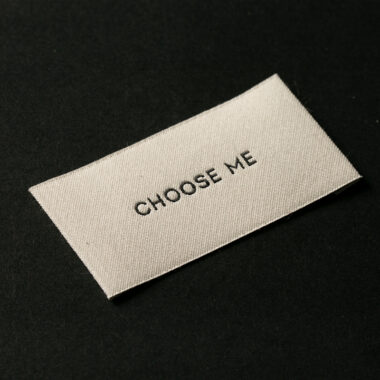 Custom designed sew-in folded woven clothing labels