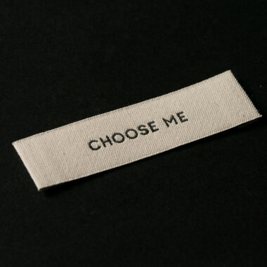 Custom designed sew-in folded woven clothing labels