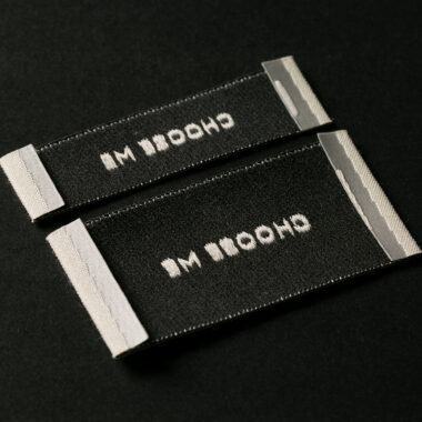 Custom designed sew-in folded woven clothing labels