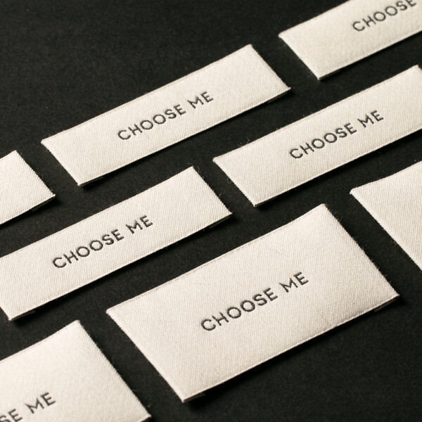 Custom designed sew-in folded woven clothing labels