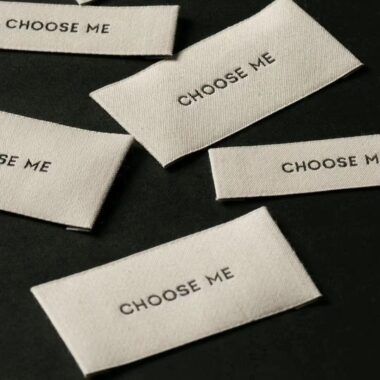 Custom designed sew-in folded woven clothing labels