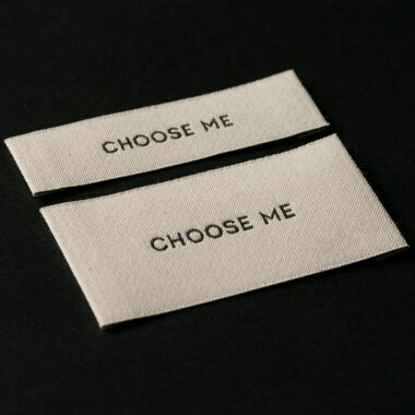 Custom designed sew-in folded woven clothing labels