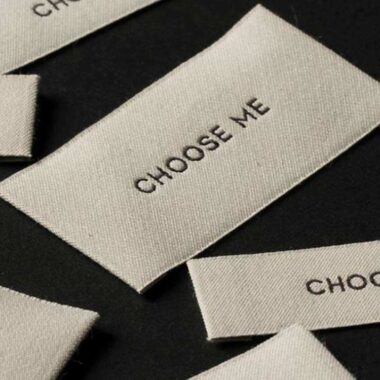 Custom designed sew-in folded woven clothing labels